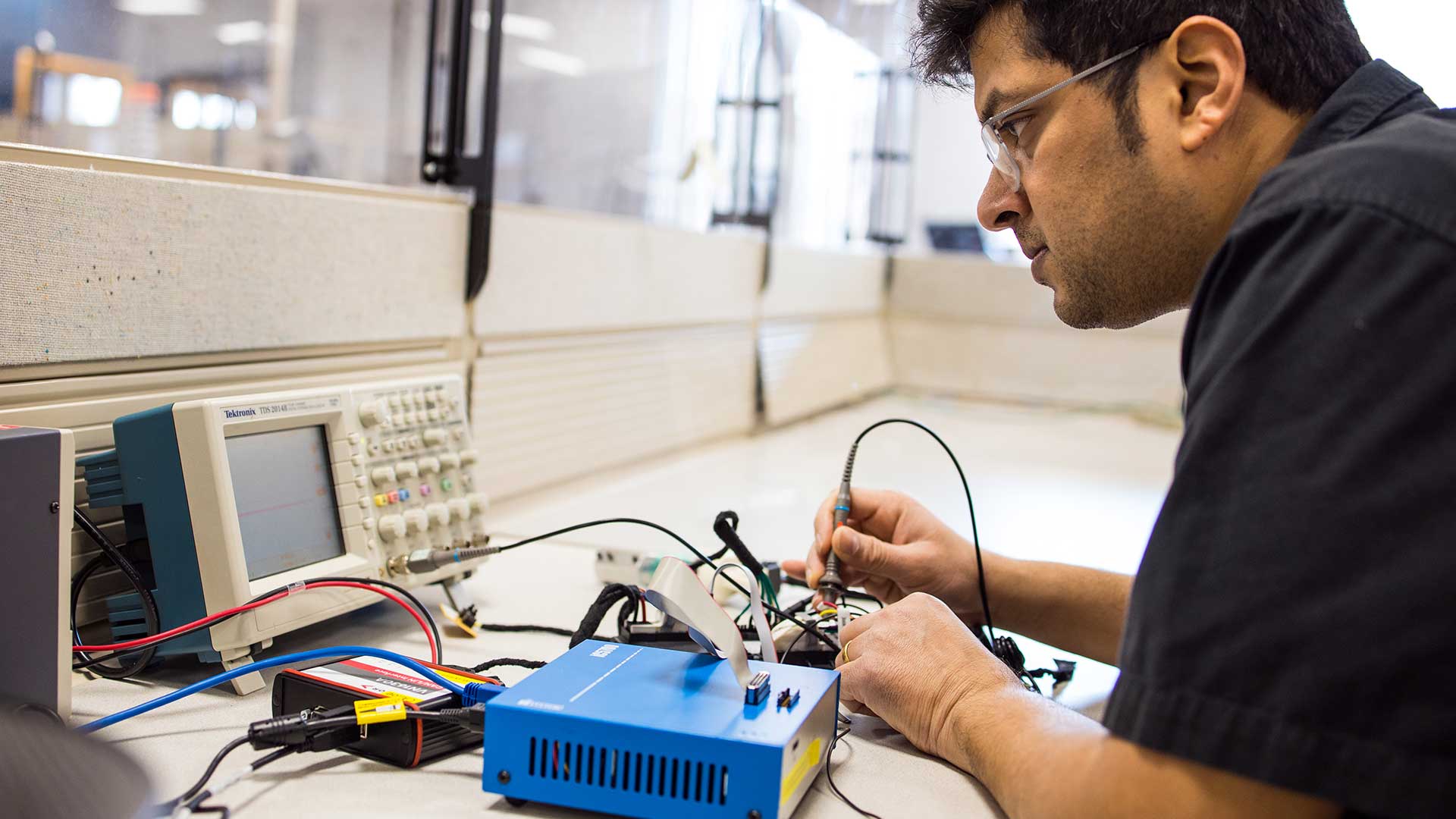 Multimatic Electronic Systems - Man working on electronics